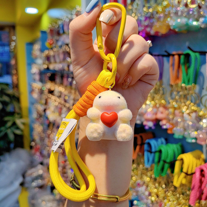 Nuevo caricatura flocado amor Godzilla llavero de moda pareja llavero bolsos de mujer accesorios colgantes de teléfono móvil joyas