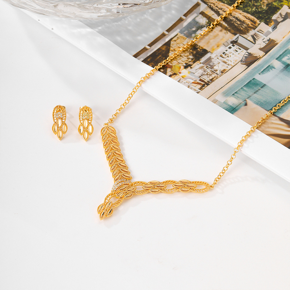 Joyería de moda europea y americana para mujeres bronce dorado pendientes de piedra de aluminio collar de dos piezas opciones de joyería transfronterizas