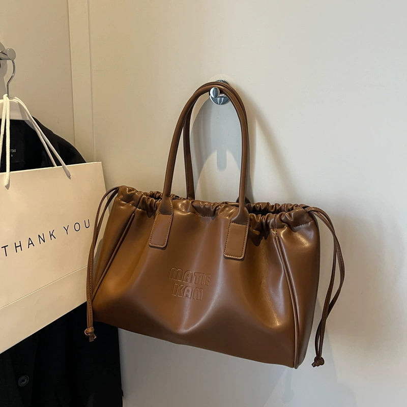 Universal small design shoulder bag, capacious one-shoulder bag, 2023 collection, genuine leather, drawstring