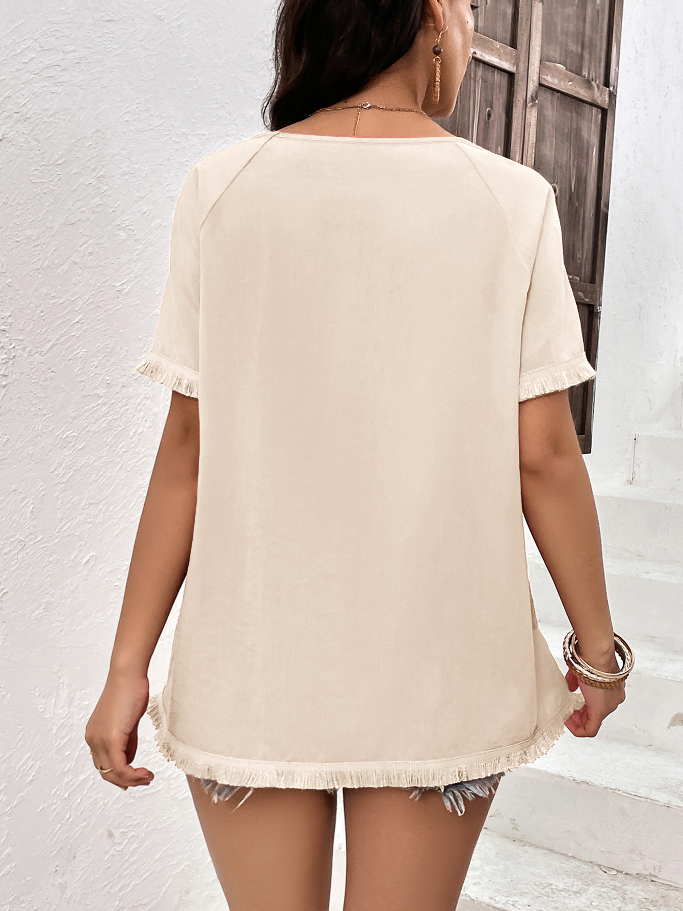Top casual ampio con scollo tondo e frange da donna_voghion.com