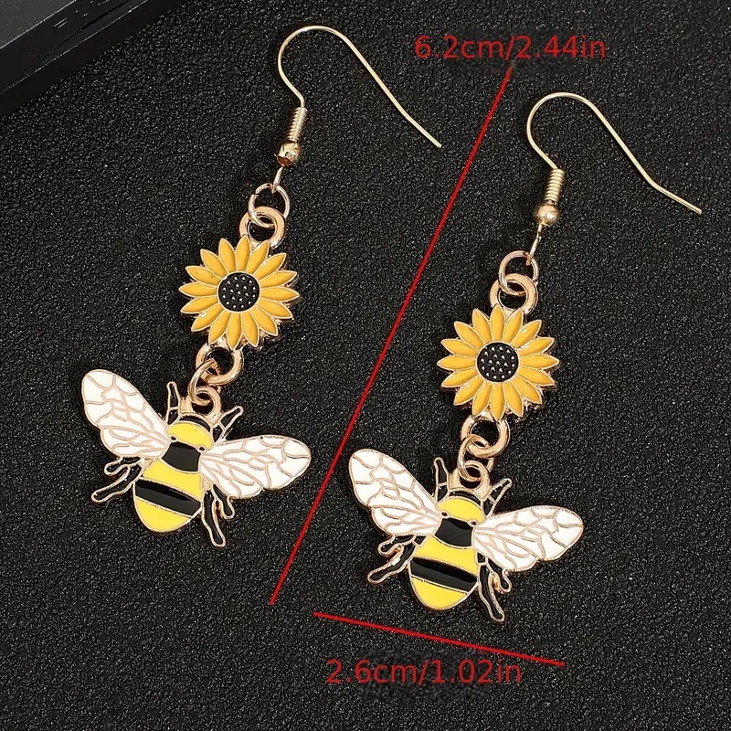 Suxin transfronterizo Europa y América de venta caliente personalidad de dibujos animados pendientes de abeja simple aleación goteo de aceite margarita flores pendientes para mujeres