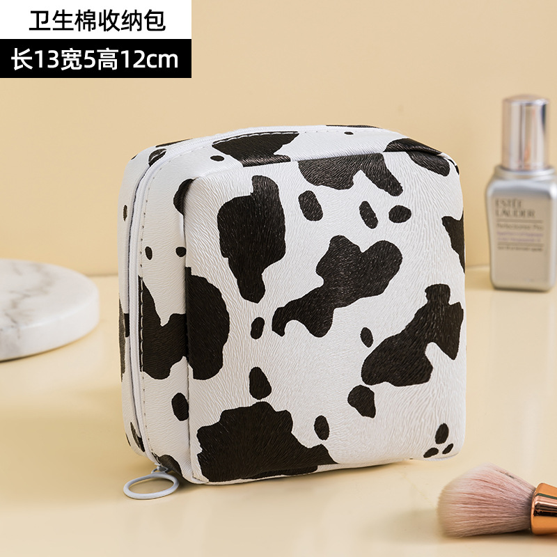 Patrón de vaca PU bolsa de cosméticos impermeable de gran capacidad de alto aspecto portátil avanzado bolsa de almacenamiento cuidado de la piel bolsa de lavado al por mayor