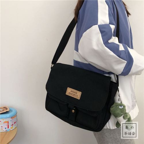 Backpack women's Korean Instagram student large-capacity shoulder messenger bag men's Japanese Harajuku retro workwear crossbody ginger tea