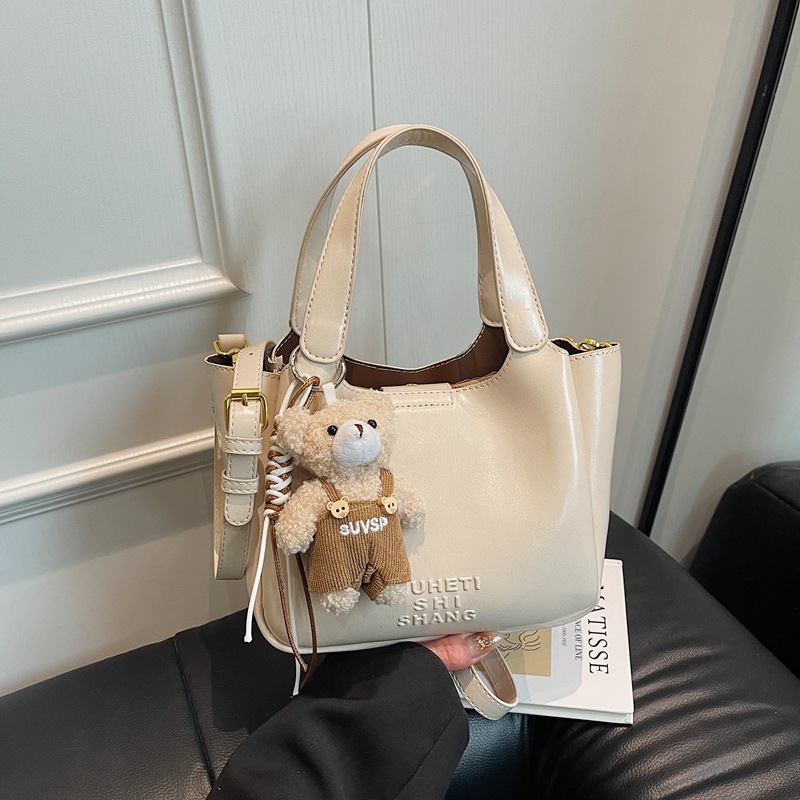 Vintage Maillard bolso de mano para mujeres 2025 nuevo estilo transfronterizo popular aceite cera cuero bolso de cubo textura mochila