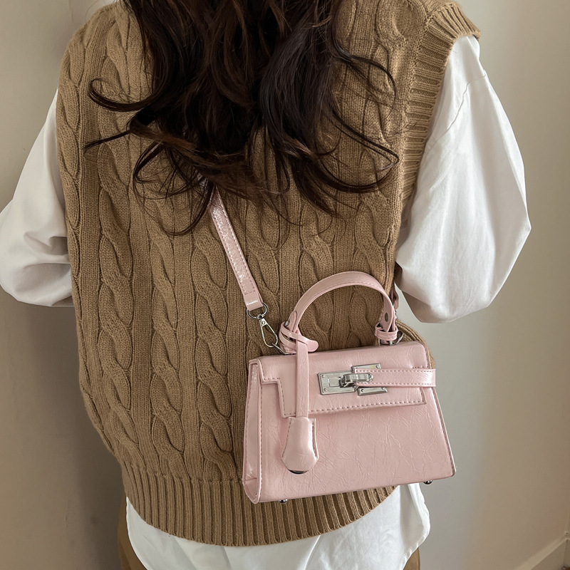 Nicho de diseño Kylie bolso mujer 2026 nuevo bolso pequeño bolso portátil mochila simple sensación cotidiana de viaje bolsa de hombro