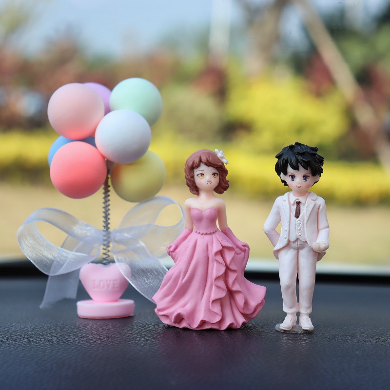 Nuevos accesorios de automóviles consola al por mayor muñecas creativas de dibujos animados accesorios de automóviles decoraciones de boda pareja