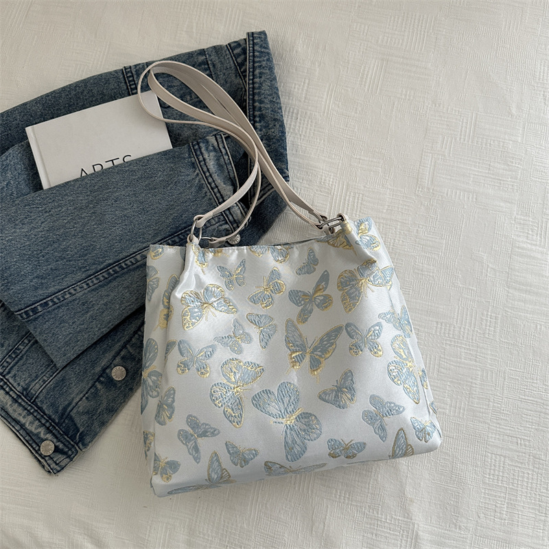 Nueva bolsa de gran capacidad de estilo chino para mujeres 2024 nueva moda bordada bolsa de hombro para trabajar bolsa de viaje moda