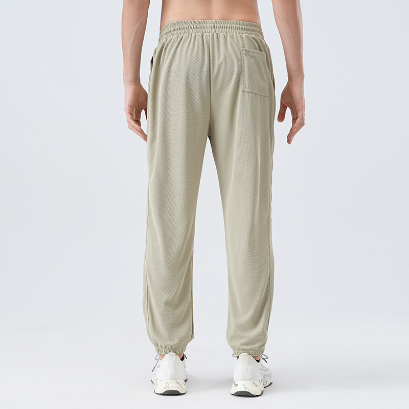 Pantalones deportivos de tejido para hombres respirantes absorbientes de humedad secado rápido entrenamiento de maratón de atletismo para correr pantalones casuales
