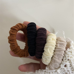 Elastic hair tie for stylish and minimalist ponytail, durable and gentle on hair, adds a touch of elegance to your hair accessories.