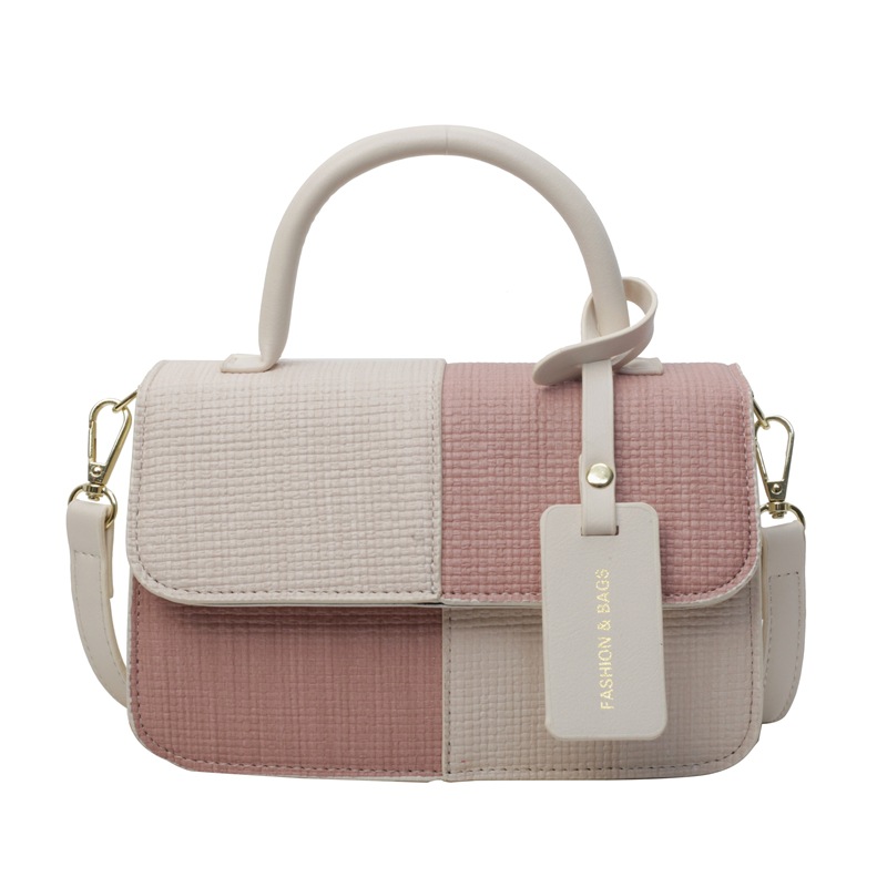 Bolso de mano coreano de contraste de color para mujeres 2024 primavera y verano nuevo bolso de moda universal bolso pequeño de nicho textura mochila
