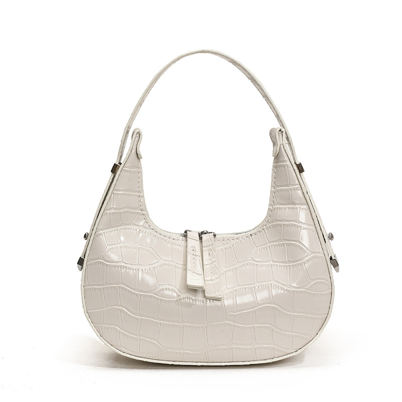 Bolso de axila con textura transfronteriza 2025 primavera nuevo bolso femenino bolso retro con patrón de piedra bolso de hombro brillante de charol