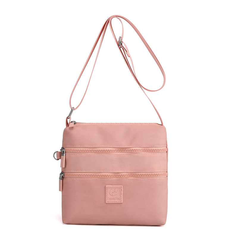 Bolsos de tela pequeños al por mayor, bolsos de nylon, bolsos de hombro para mujeres, tendencia coreana, mochilas ligeras al aire libre, bolsos de tela prácticos de varias capas