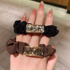 高級感のあるドリルの髪ひもの女性は団子の頭の大きい腸の輪の高弾力の丈夫な髪飾りの馬尾の髪ひもの皮カバーを刺します。