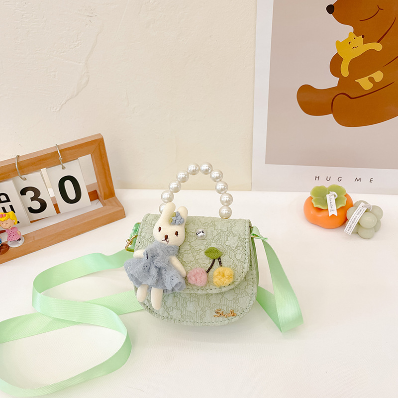 Bolso oblicuo de los niños de estilo coreano princesa estilo occidental bolso de hombro de dibujos animados conejito perla bolso niñas fuera monedero