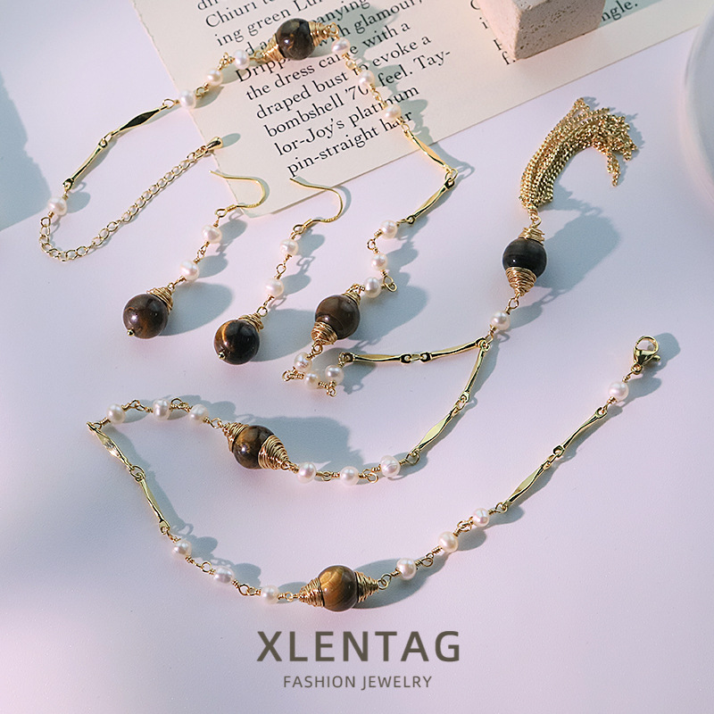 Perla natural ojo de tigre oreja gancho pendientes collar conjunto retro alta sensación pendientes temperamento joyas al por mayor