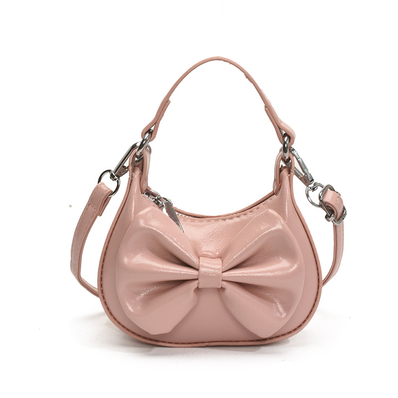 Nuevo comercio exterior bolsos de niños de color sólido bolsos de princesa coreana simple arco mini bolsos de bebé