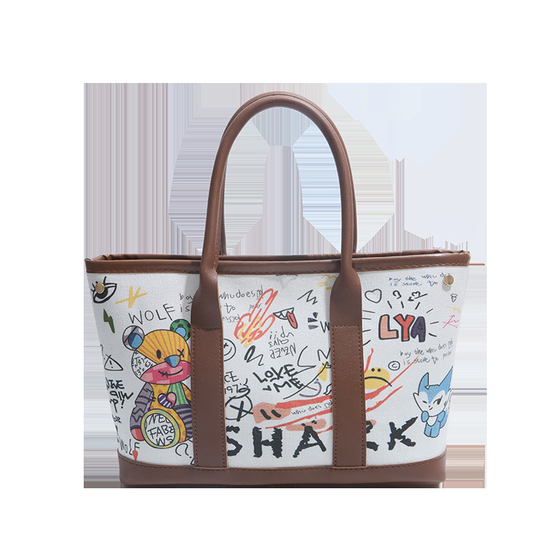 Invierno nuevo bolso de mujer personalidad graffiti portátil 2026 letras casuales Bear Tot bolso de cubo de hombro mochila