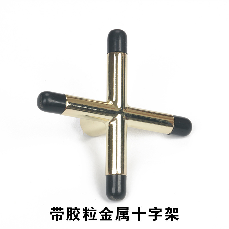 Metal cross with glue particles
