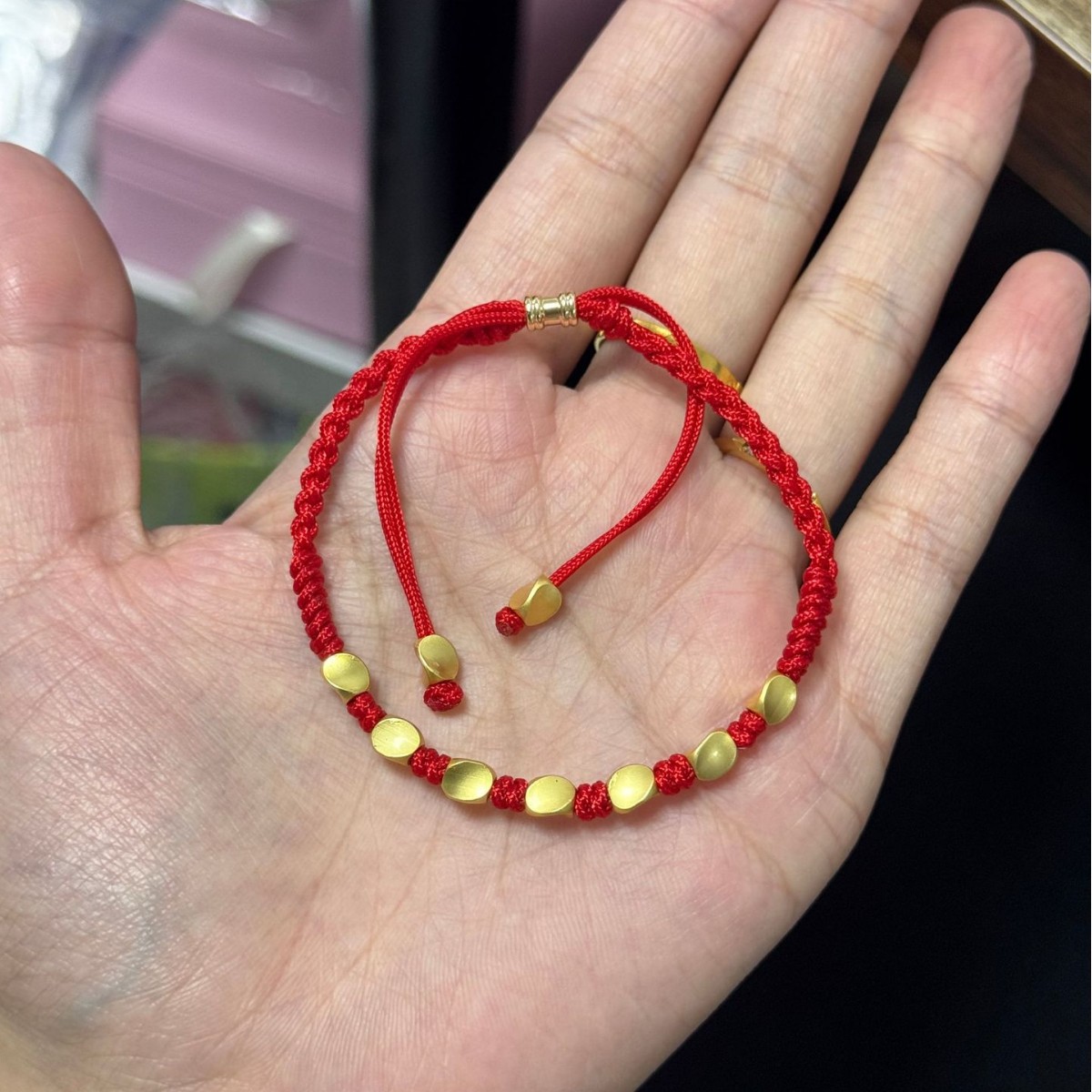 A collection of various hand-woven red cords, unisex couple's bracelets, perfect as a birthday gift for a best friend or a handmade cord for students