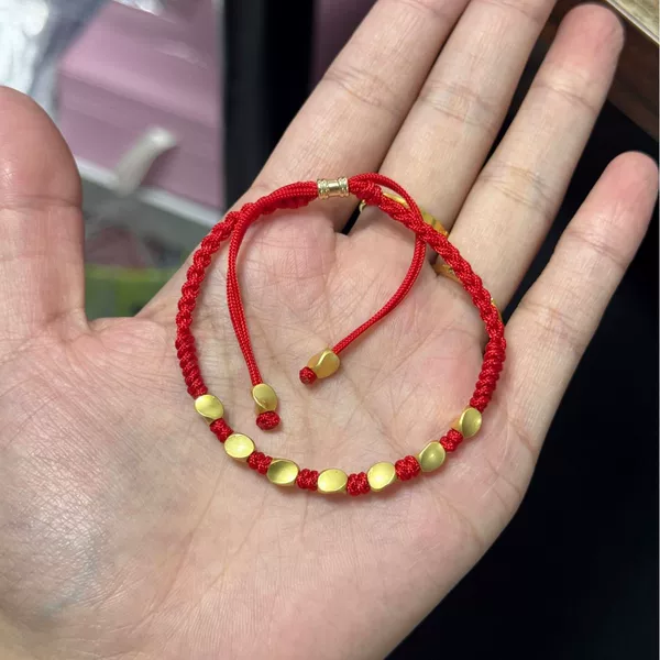 A collection of various hand-woven red cords, unisex couple's bracelets, perfect as a birthday gift for a best friend or a handmade cord for students