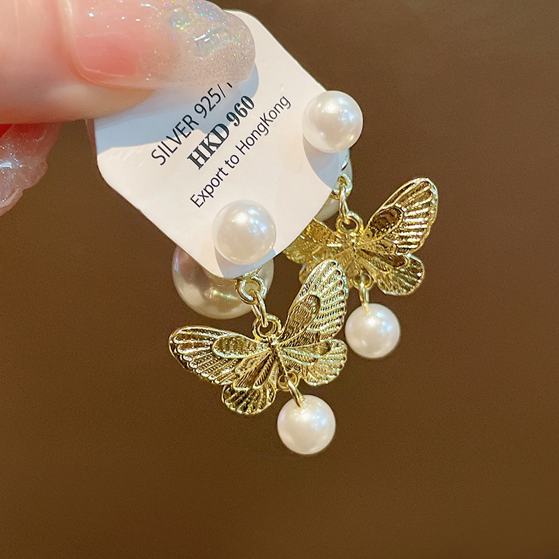 Pendientes de perlas de aceite con goteo de aguja de plata Pendientes de todo fósforo de moda, lujo ligero, joyería retro de alta gama al por mayor, fabricante de Yiwu
