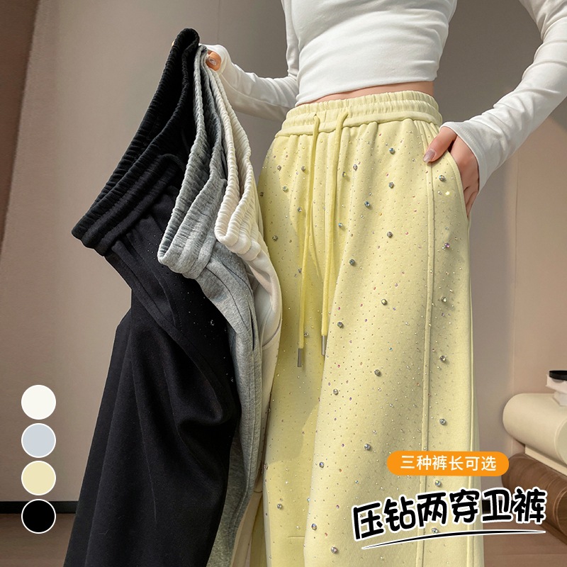 El nuevo taladro de presión de primavera y verano 2026 está lleno de estrellas del cielo, cintura alta, pies anchos, piernas anchas, dos mujeres con pantalones de baño y pantalones casuales rectos.