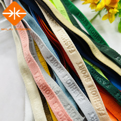 新商品の弾力性のあるアルファベットのエンボスの花の字のリボンの子供服のカーディガンの後で襟元の縁の布の服装の補助材料を締めます。