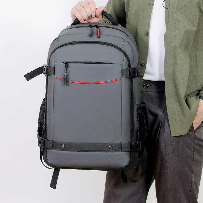 Comercio exterior al por mayor mochila de gran capacidad colgante barra de tracción mochila de viaje de negocios mochila a prueba de rociamientos simple mochila de computadora sólida