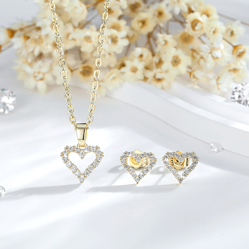 Ventas transfronterizas calientes de cobre 14K oro color amor collar pendientes de zircón corazón europeo y americano colgante conjunto de joyas mujeres