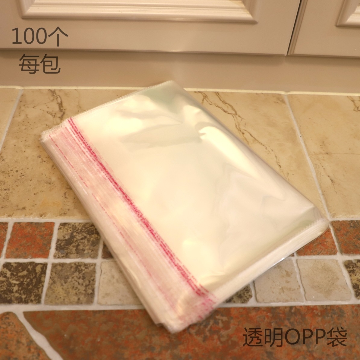 义乌OPP袋厂家供应5丝厚30*34CM透明不干胶包装袋服装袋100个每包