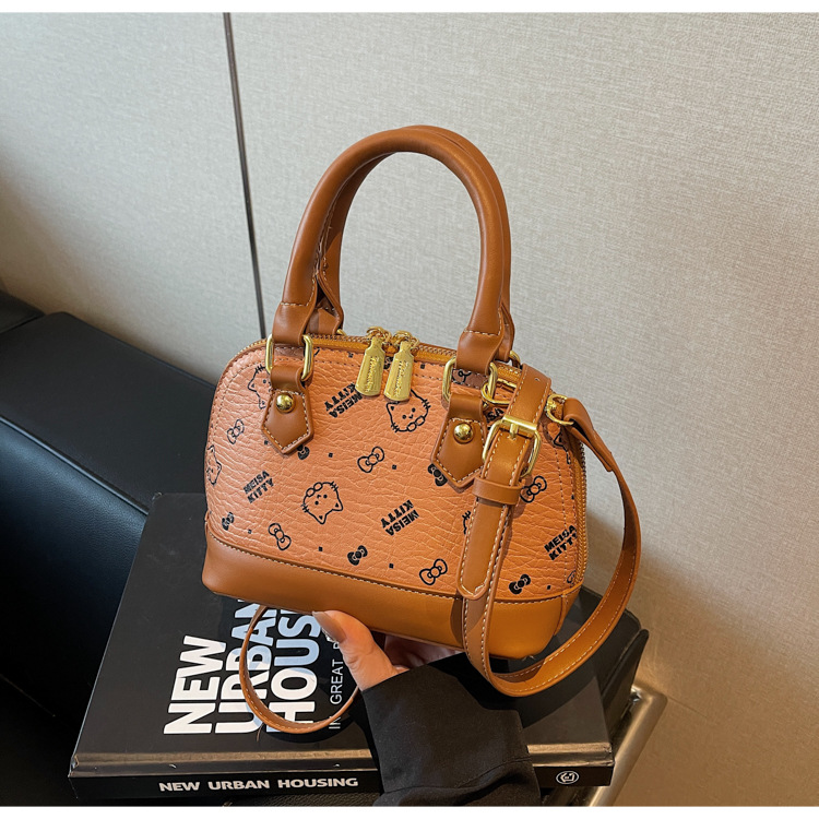 Bolso de mochila para mujeres 2025 textura fresca de alta calidad felina de moda versátil bolso coreano de viaje bolso de hombro