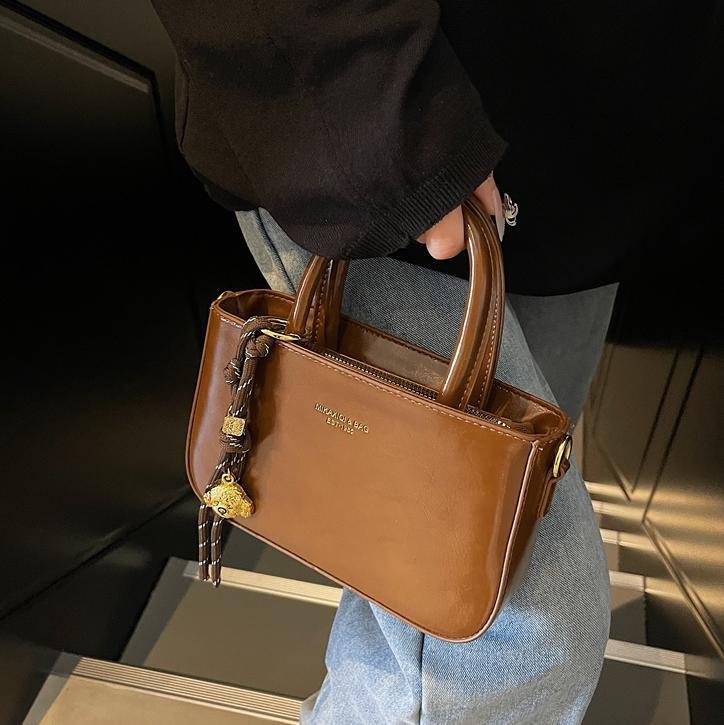 Transfronterizo simple bolso de mano ocio para mujeres 2025 nuevo bolso de hombro de moda retro popular bolso de mochila versátil