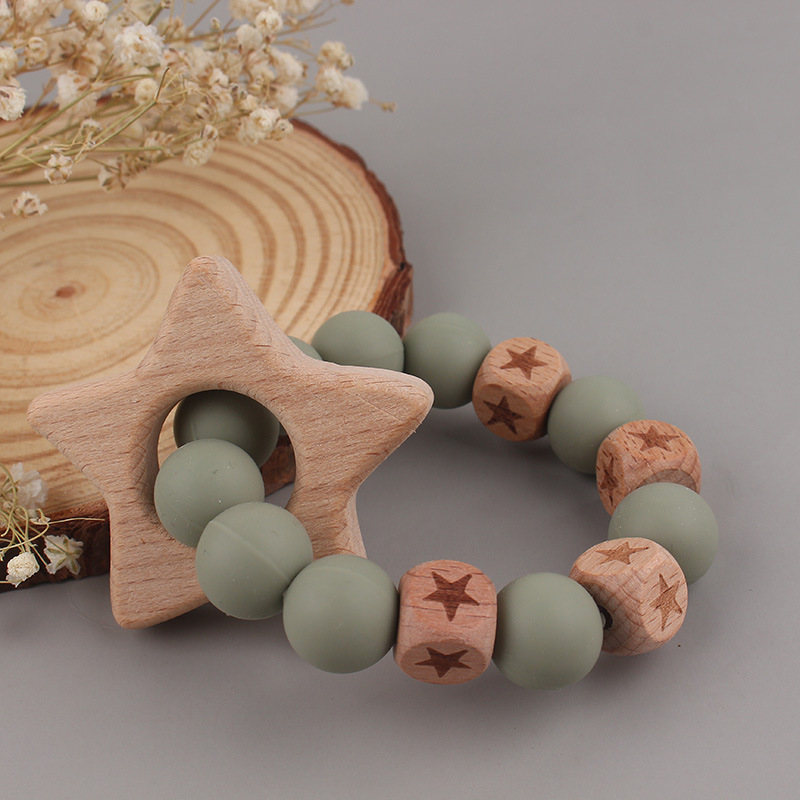 La pulsera de mordedor para bebé de juguete de haya 2025 puede morder el mordisco del bebé