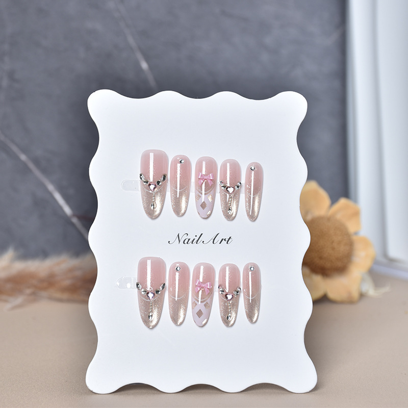 Use un parche de uñas falsas, ojo de gato puro, arco rosa, temperamento de manicure, desmontable.