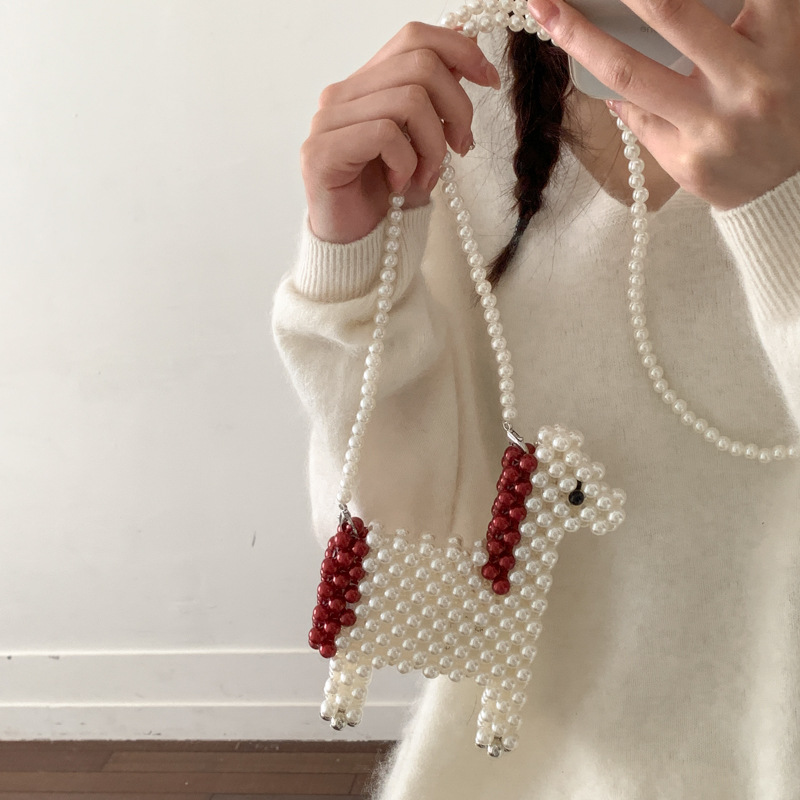 Bonita alpaca para hombres y mujeres bolsas de hombro tejidas a mano mini bolsas de perlas nuevas bolsas de accesorios para niños de comercio exterior