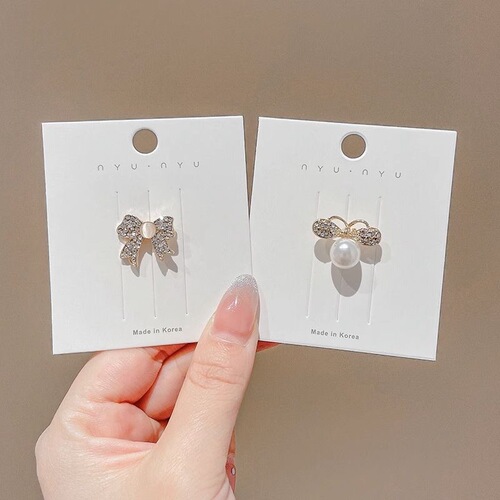 Butterfly knot cat's eye stone brooch for women, cute Japanese style, anti-hiding fastener, Instagram trendy, personalized pin to fix clothes, accessory