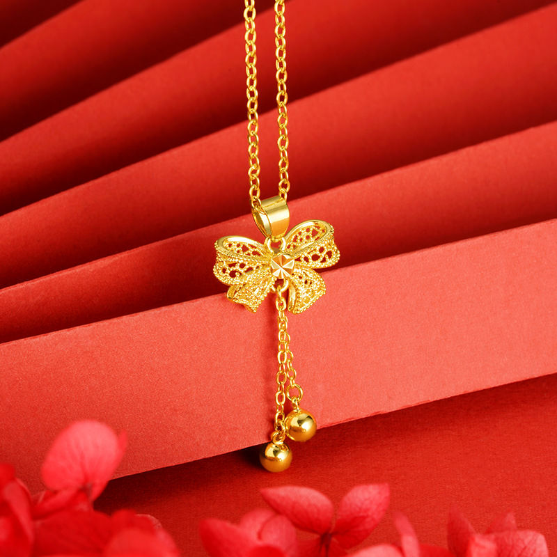 Princesa arco colgante dulce moda todo-fósforo de las mujeres en línea rojo caliente borla DIY arena oro collar Accesorios