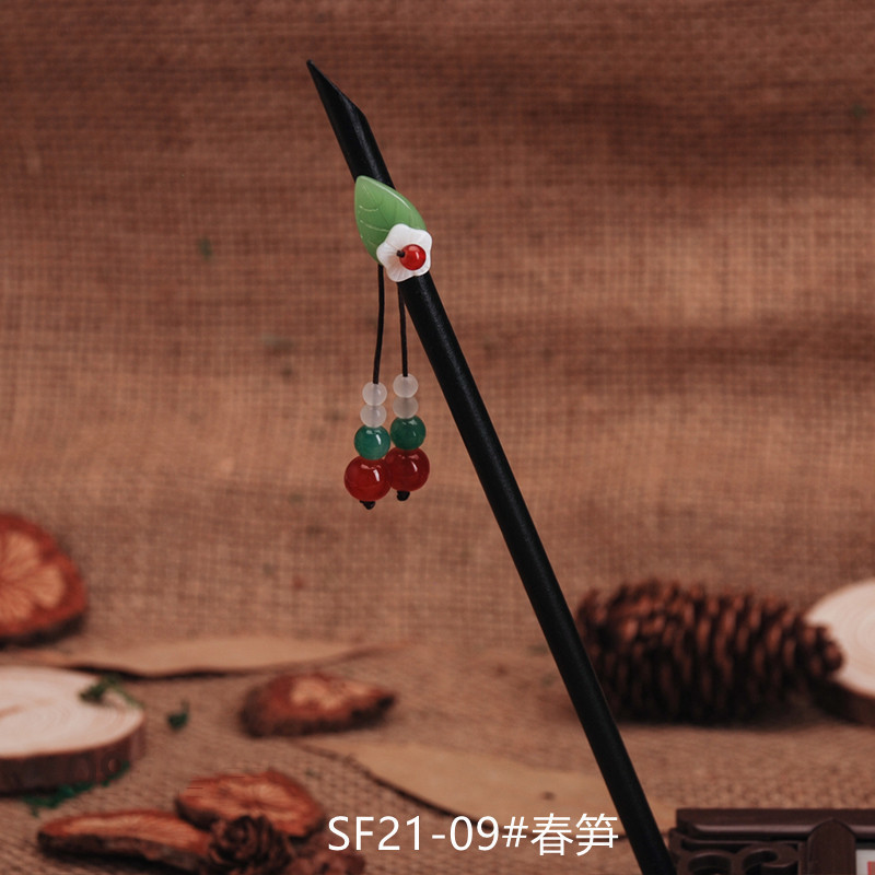 黒檀の木のかんざしのフリンジをまねて、かんざしの子供の古風な頭飾りをします。|undefined