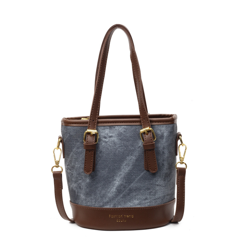 Bolso de mano de color de contraste de comercio exterior para mujer 2025 nuevo bolso de cubo de ocio salvaje simple bolso de mensajero de un solo hombro de alta gama