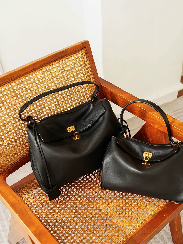 Black capacious one-shoulder bag for men and women