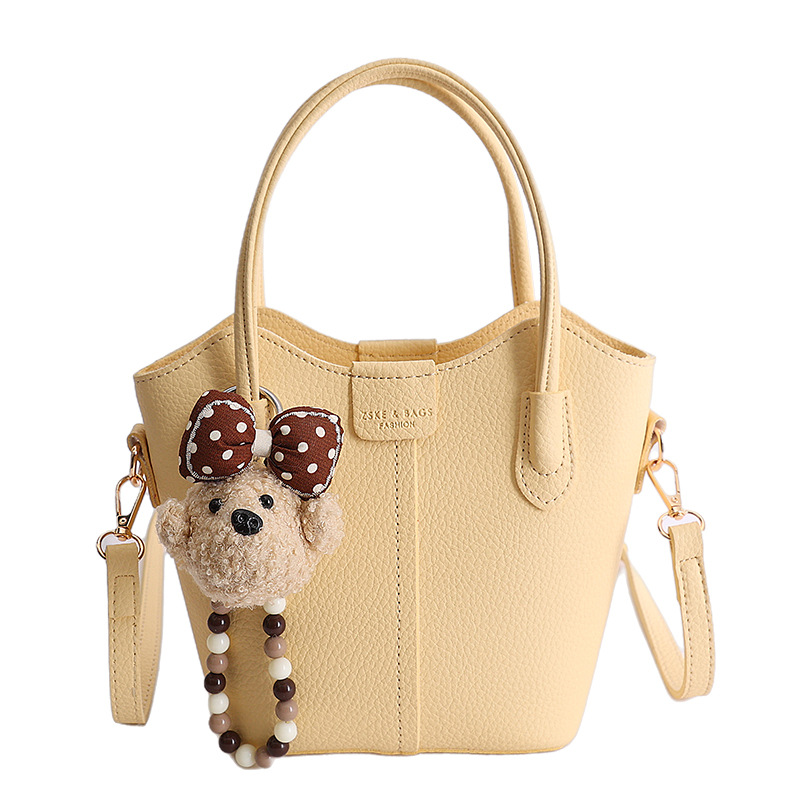 Bolso de mano de moda retro 2026 nuevo temperamento simple bolso de cubo de viaje ocio mochila de hombro