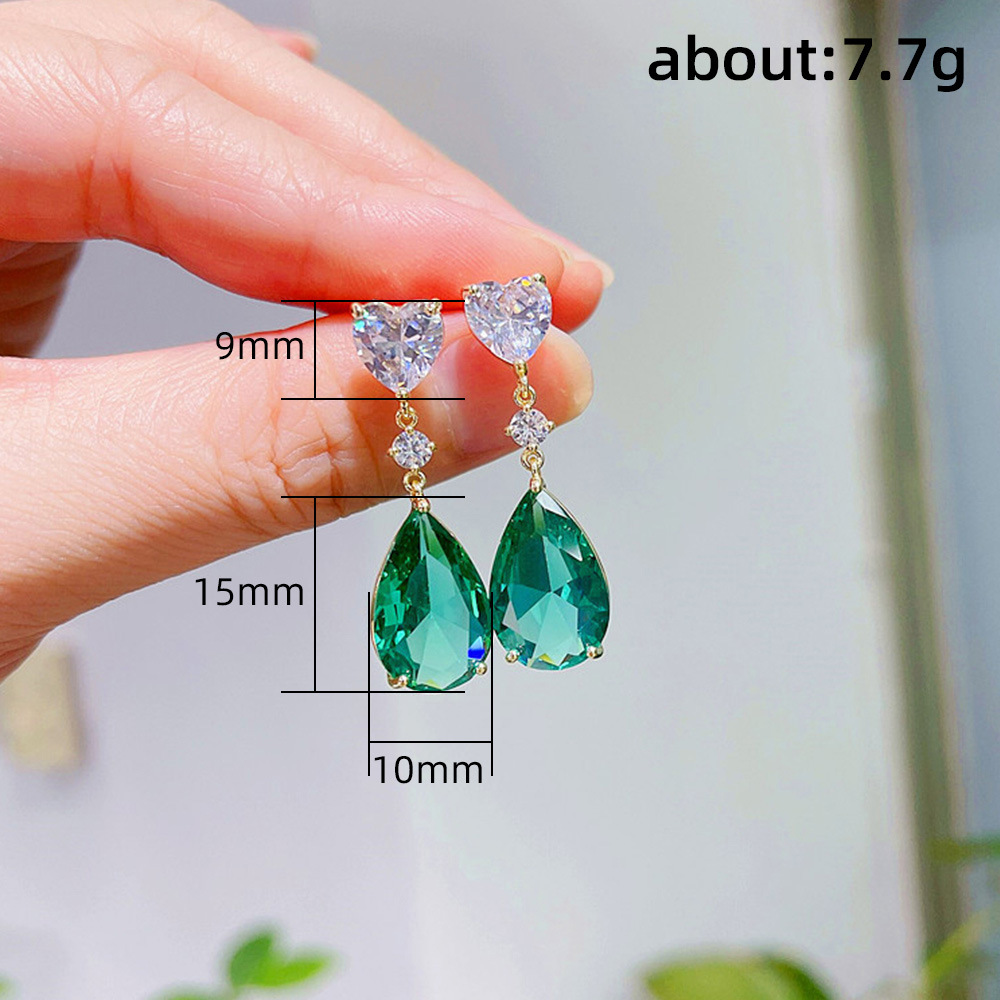 Gli squisiti orecchini in zircone con cristallo di zaffiro blu mare di Cao Shi sono un nuovo prodotto estivo. Sono orecchini pendenti a forma di pera leggeri e lussuosi_voghion.com
