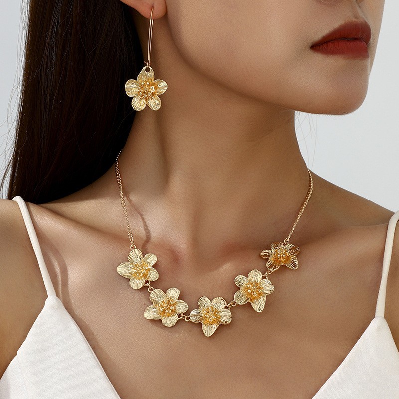 Europa y los Estados Unidos moda transfronteriza venta caliente flor simple personalidad universal mujer raqueta de calle conjunto de decoración joyas de moda