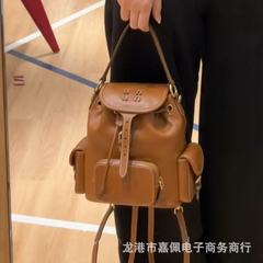 張元英は同じタイプのレトロなカラメル色のリュックサックの純色のひものバケツのカジュアルなリュックサックの女性スターと同じタイプの女性のカバンです。