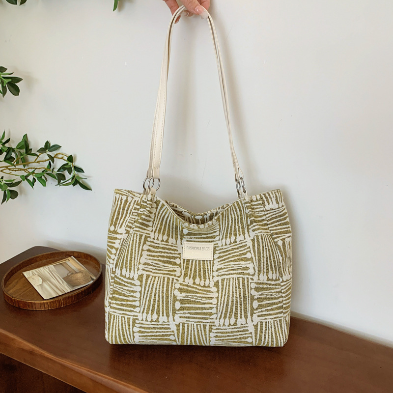 Bolsa multipropósito coreana de hombro de mujer, nicho de diseño de textura portátil, bolso de hombro de mujer, pequeño bolso fresco.