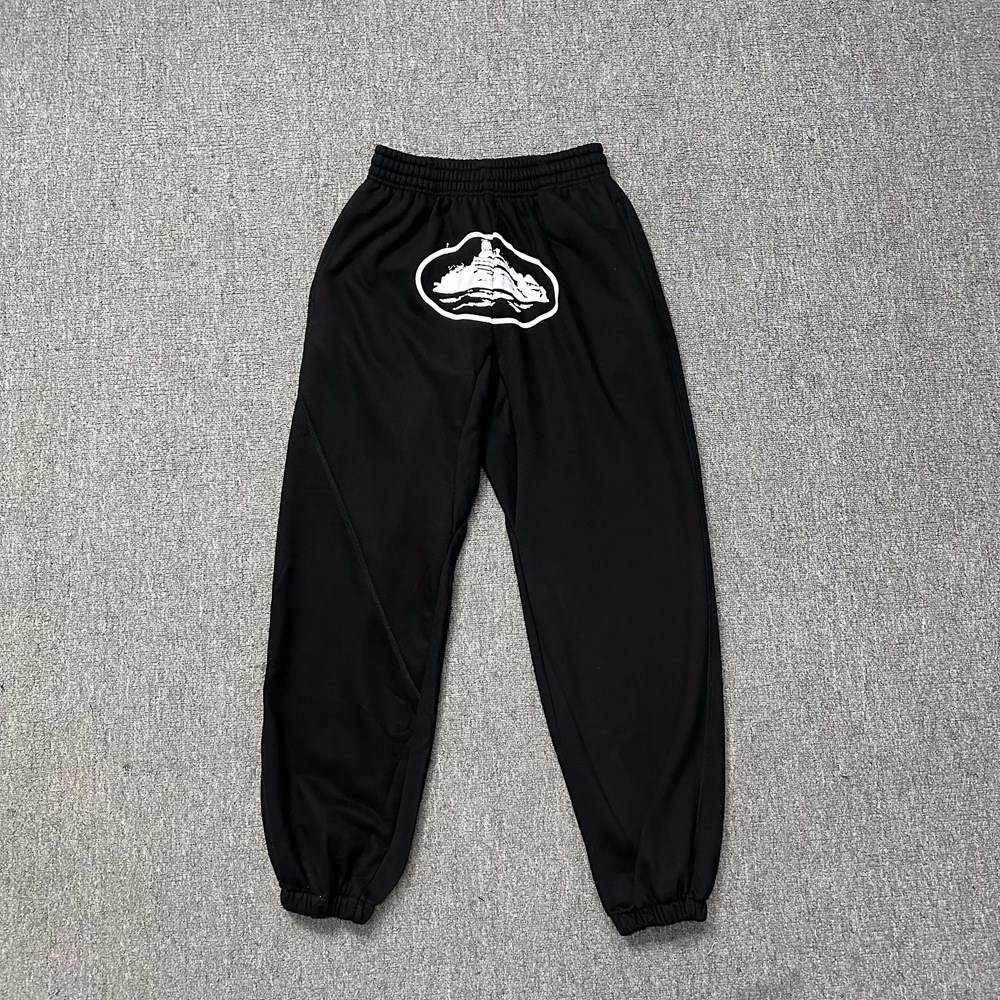 Versión alta de moda de terciopelo con chaqueta encapuchada, pantalones casuales, nuevos pantalones de otoño y invierno para hombres