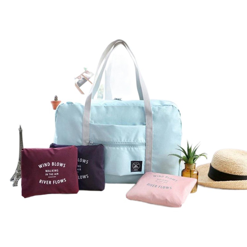 Bolsa de embalaje en movimiento estilo coreano de gran capacidad ropa organización edredón almacenamiento Segunda Generación aviones bolsa portátil plegable bolsa de viaje