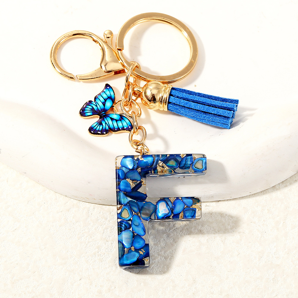 Nuevo transfronterizo mariposa 26 letras inglesas de cristal goteo llavero bolsos accesorios colgante de automóviles