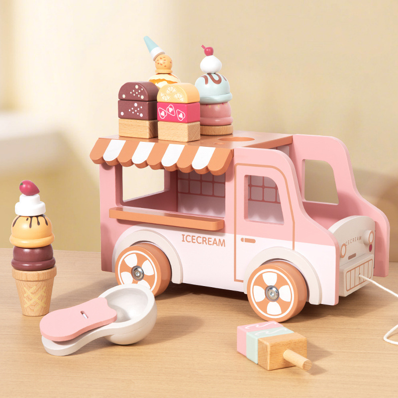 Wooden pink ice cream vending cart on tabletop