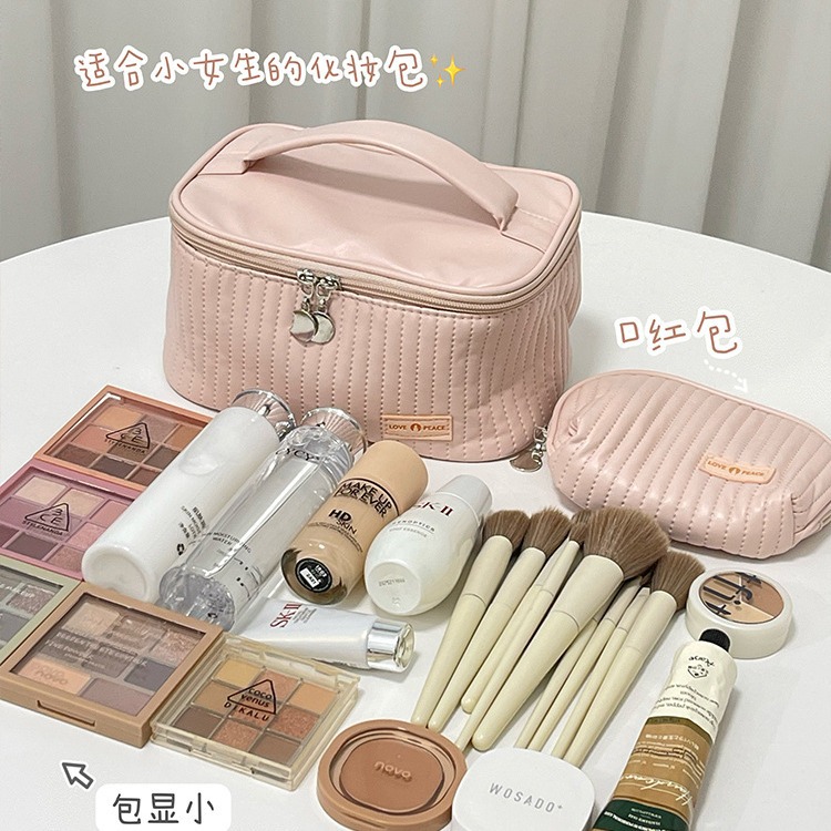 Nueva bolsa de maquillaje de pastel portátil portátil nicho de viaje de alto valor facial adorable bolsa de almacenamiento de cosméticos para productos de cuidado de la piel